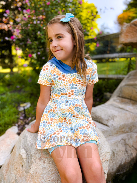 Grow With Me Hooded Hi-Low Wildflowers Peplum – Short Sleeve